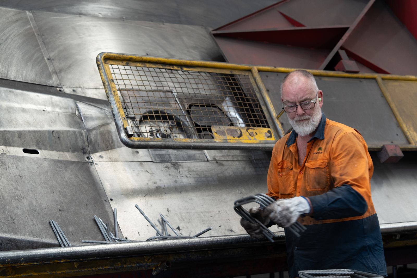 Bianco worker operating a bar bending machine