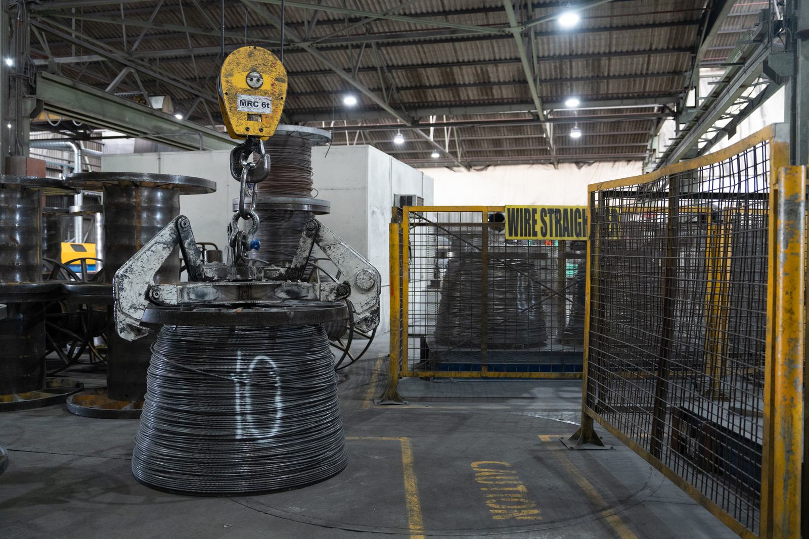 Coil being lifted in the wire plant